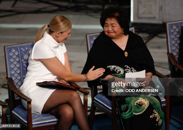 Beatrice Fihn , leader of ICAN , talks with Hiroshima nuclear bombing survivor Setsuko Thurlow at the city hall in Oslo, Norway, during the award...