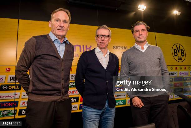 Manager Peter Stoeger is presented as the new head coach of Borussia Dortmund during the press conference with Hans-Joachim Watzke , l., and Michael...