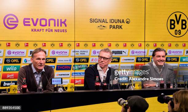 Manager Peter Stoeger, m., is presented as the new head coach of Borussia Dortmund during the press conference with Hans-Joachim Watzke , l., and...