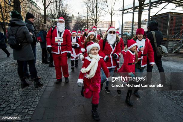 Participants in the Stockholm Santa Run begin their race at Kungstradgarden on December 10, 2017 in Stockholm, Sweden. The Stockholm Santa Run is an...