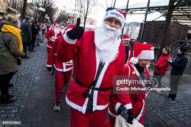 Participants in the Stockholm Santa Run begin their race at Kungstradgarden on December 10, 2017 in Stockholm, Sweden. The Stockholm Santa Run is an...