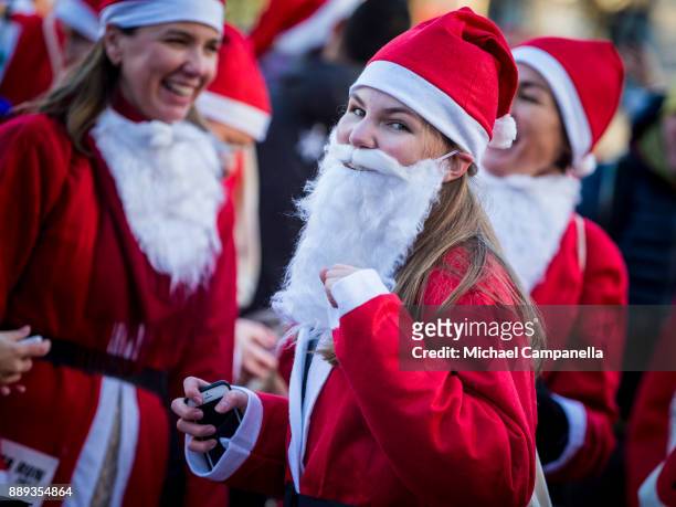 Participant in the Stockholm Santa Run warming up at Kungstradgarden on December 10, 2017 in Stockholm, Sweden. The Stockholm Santa Run is an annual...
