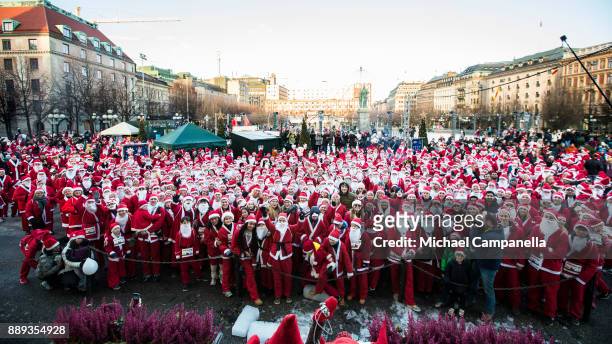 Participants in the Stockholm Santa Run pose for a picture at Kungstradgarden on December 10, 2017 in Stockholm, Sweden. The Stockholm Santa Run is...