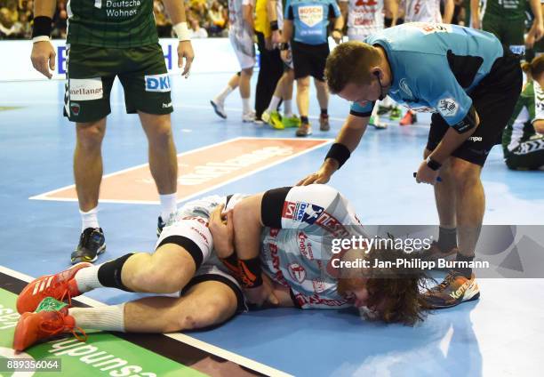 Mattias Zachrisson of Fuechse Berlin and referee Peter Behrens during the DKB Handball Bundesliga game between Fuechse Berlin and dem MT Melsungen at...