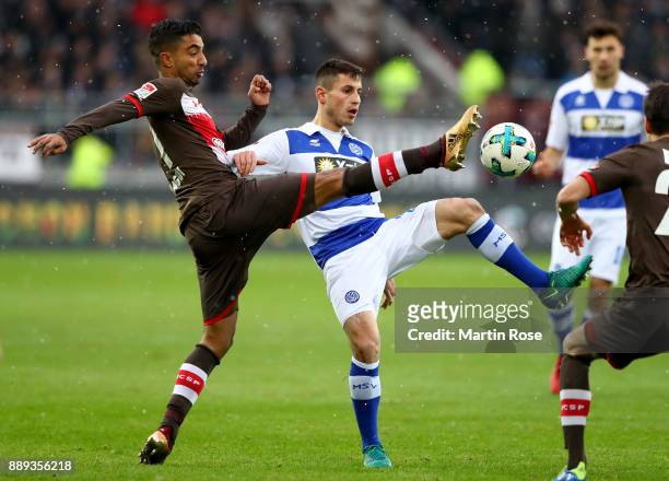 Sami Allagui of St. Pauli and Fabian Schnellhardt of Duisburg battle for the ball during the Second Bundesliga match between FC St. Pauli and MSV...