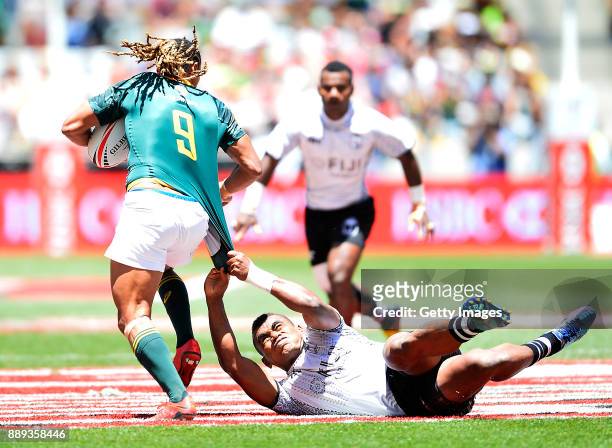 Eroni Sau of Fiji tackles Justin Geduld of South Africa during day 2 of the 2017 HSBC Cape Town Sevens match between South Africa and Fiji at Cape...