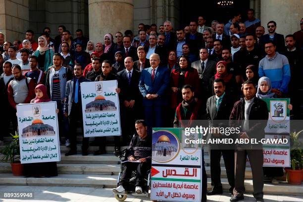 Egyptian students and professors of Cairo University take part in a gathering on December 10 to protest against Washington's decision to recognise...