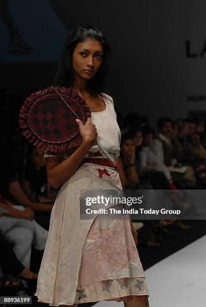 Model is walking on the ramp with Fashion designer Agnimitra Paul outfit at Lakme Fashion Week Spring Summer-2007 in Mumbai, Maharashtra, India )