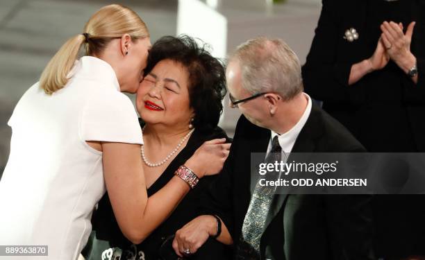 Beatrice Fihn , leader of ICAN , hugs Hiroshima nuclear bombing survivor Setsuko Thurlow as Henrik Syse , member of the Norwegion Nobel Committee,...