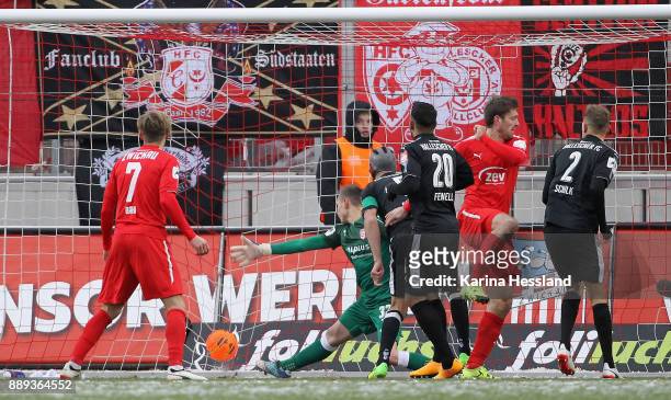 Ronny Koenig of Zwickau scores the opening goal, Goalkeeper Tom Mueller of Halle without a chance during the 3.Liga match between FSv Zwickau and...