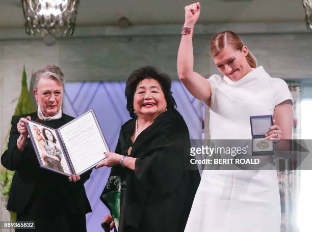 Berit Reiss-Andersen , chairperson of the Norwegian Nobel Committee, hands over the 2017 Nobel Peace Prize to Beatrice Fihn , leader of ICAN , and...