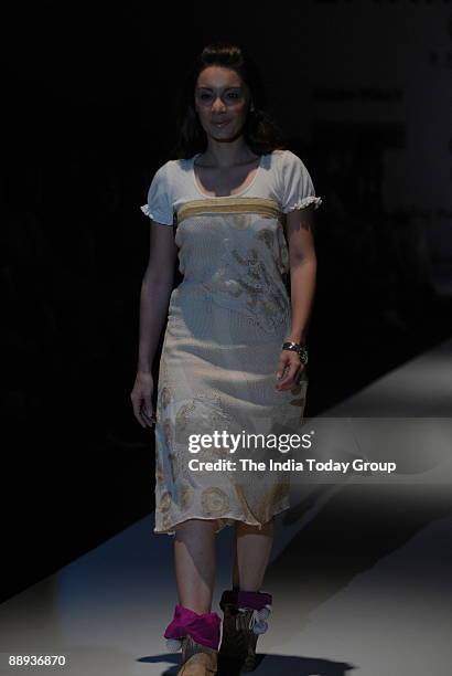 Model is walking on the ramp with Fashion designer Agnimitra Paul outfit at Lakme Fashion Week Spring Summer-2007 in Mumbai, Maharashtra, India