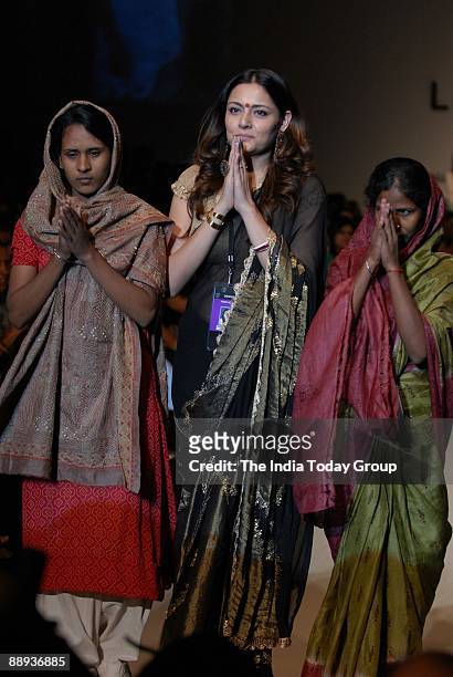 Fashion designer Agnimitra Paul along with Models are walking on the ramp with her outfit at Lakme Fashion Week Spring Summer-2007 in Mumbai,...