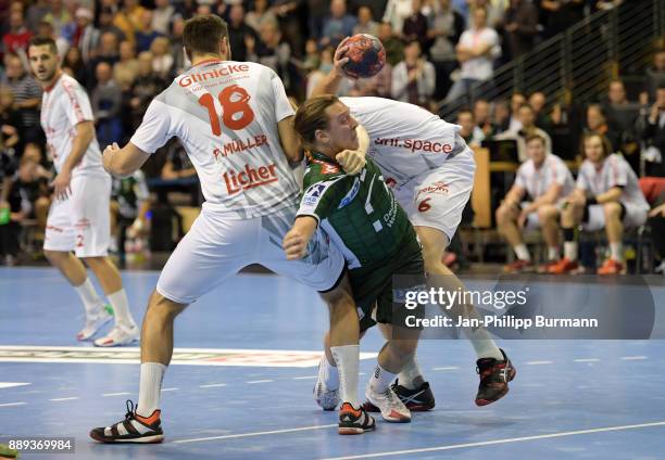 Philipp Mueller of MT Melsungen, Mattias Zachrisson of Fuechse Berlin and Finn Lemke of MT Melsungen during the game between Fuechse Berlin and dem...