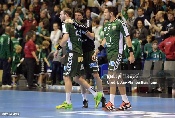 Steffen Faeth, Kevin Struck and Stipe Mandalinic of Fuechse Berlin after the game between Fuechse Berlin and dem MT Melsungen on december 10, 2017 in...