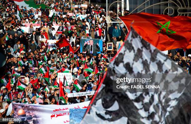 Pro-Palestinian protesters wave Palestinian and Moroccan flags during a demonstration in Rabat against US President Donald Trump's declaration of...