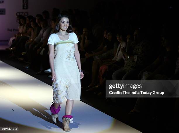 Model is walking on the ramp with Fashion designer Agnimitra Paul outfit at Lakme Fashion Week Spring Summer-2007 in Mumbai, Maharashtra, India