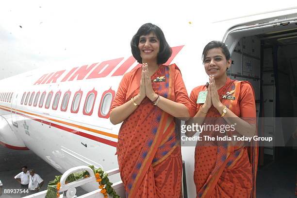 Air India air hostesses in their new uniform atop the Air India flight, during the delivery of the Boeing 737-800 VT-AXH to its own fleet at Indira...
