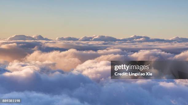 cloud typologies - scenic view above the clouds - cloud typologies stock-fotos und bilder