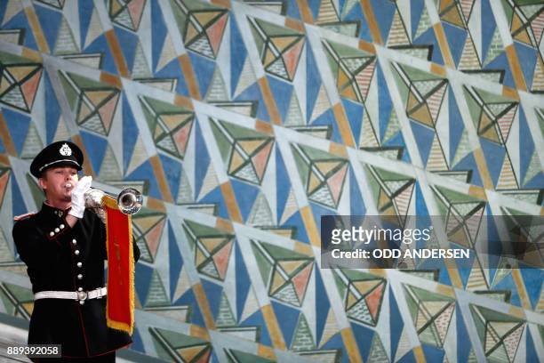 Musician plays his wind instrument at the city hall in Oslo, Norway, during the award ceremony of the 2017 Nobel Peace Prize on December 10, 2017....