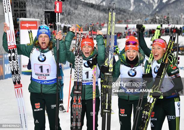 Germany's Vanessa Hinz, Franziska Hildebrand, Maren Hammerschmidt and Laura Dahlmeier celebrate their victory during the women's 4x6 km relay event...