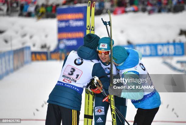 Ukraine's Vita Semerenko, Olena Pidhrushna and Valj Semerenko celebrate their second place during the women's 4x6 km relay event at the IBU World Cup...