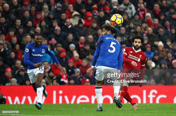 Mohamed Salah of Liverpool scores the first Liverpool goal during the Premier League match between Liverpool and Everton at Anfield on December 10,...