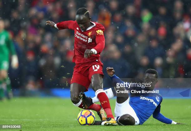Cuco Martina of Everton tackles Sadio Mane of Liverpool during the Premier League match between Liverpool and Everton at Anfield on December 10, 2017...