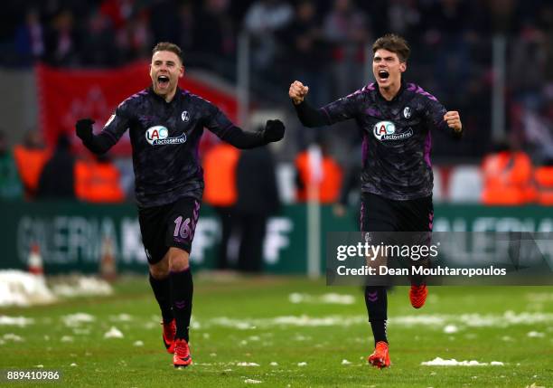 Yoric Ravet of SC Freiburg and Pascal Stenzel of SC Freiburg celebrate after the Bundesliga match between 1. FC Koeln and Sport-Club Freiburg at...