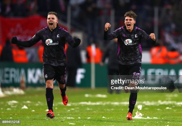 Yoric Ravet of SC Freiburg and Pascal Stenzel of SC Freiburg celebrate after the Bundesliga match between 1. FC Koeln and Sport-Club Freiburg at...