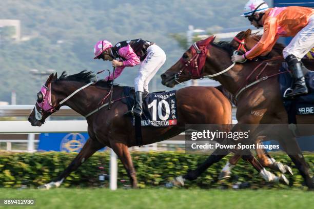 Jockey Derek K C Leung riding Beauty Generation wins the Longines Hong Kong Mile during the Longines Hong Kong International Races at Sha Tin...