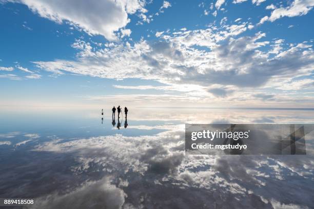 group of photographer  having fun  on salt lake at sunset - cloud reflection stock pictures, royalty-free photos & images