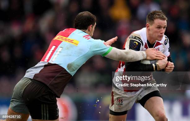 London , United Kingdom - 10 December 2017; Craig Gilroy of Ulster is tackled by Tim Visser of Harlequins during the European Rugby Champions Cup...