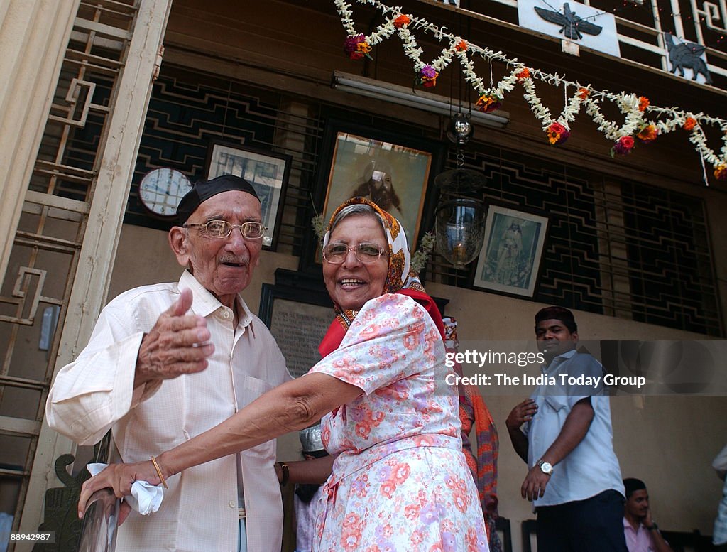 A Parsi Couple greeting each other at the fire temple on the occasion of Navroze - the Parsi New Year in Mumbai, 20 August 2007- Parsis, followers of Zoroastrianism, a small religious community which exists mostly in Mumbai, were exiled from Iran in the 7