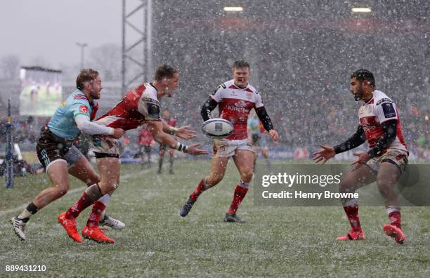 Craig Gilroy of Ulster tackled by Charlie Walker of Harlequins during the European Rugby Champions Cup match between Harlequins and Ulster Rugby at...