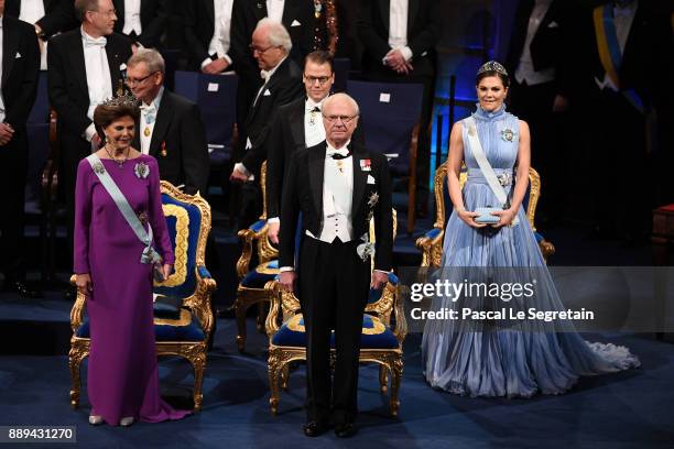 Queen Silvia of Sweden,King Carl XVI Gustaf of Sweden and Crown Princess Victoria of Sweden attend the Nobel Prize Awards Ceremony at Concert Hall on...