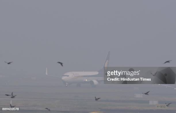 Visibility is low due to dense Smog at Mumbai airport, Vile Parle, on December 9, 2017 in Mumbai, India. A dense haze descended over Mumbai affecting...
