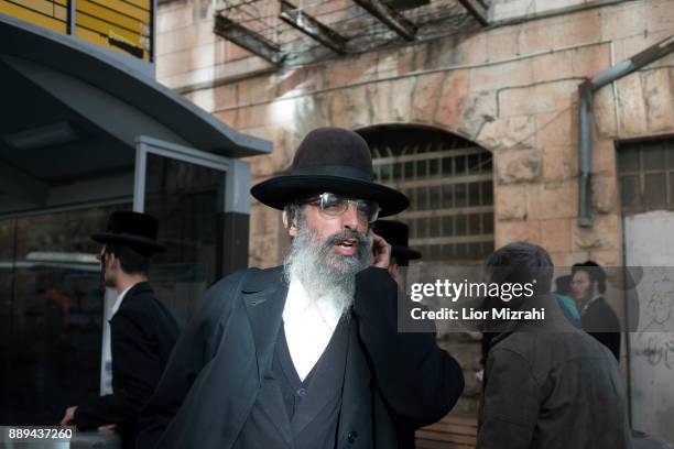 An Ultra Orthodox Jewish man watch the scene of an attack at the Jerusalem Central Bus Station on December 10, 2017 in Jerusalem, Israel. An Israeli...