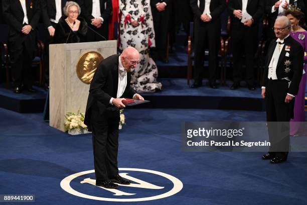 Kip S. Thorne, laureate of the Nobel Prize in physics acknowledges applause after he received his Nobel Prize from King Carl XVI Gustaf of Sweden...