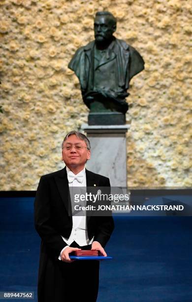 British novelist and Nobel prize for literature 2017 leaurate, Kazuo Ishiguro, acknowledges applause after being awarded during the Nobel award...