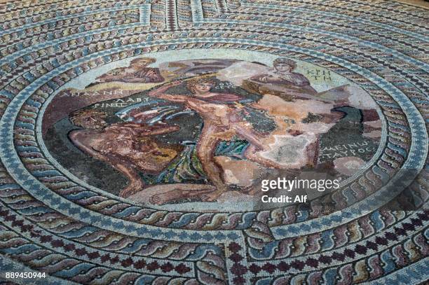 mosaic depicting theseus killing the minotaur at the theseus house in kato paphos, paphos, cyprus - theseus stock pictures, royalty-free photos & images