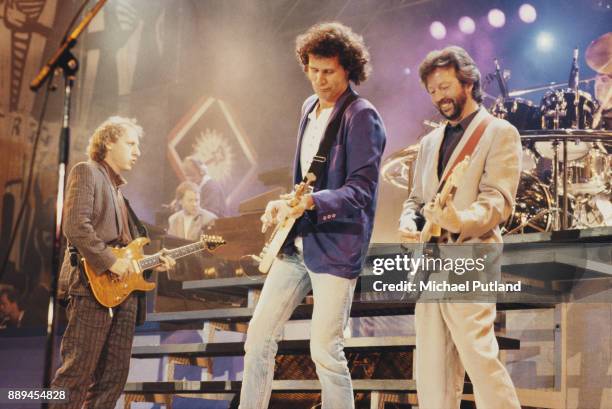 Musicians Mark Knopfler and John Illsley of Dire Straits, performing with Eric Clapton at the 70th birthday tribute concert for imprisoned South...