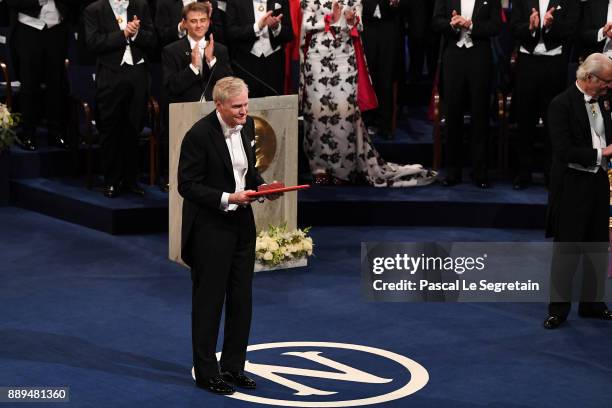 Michael W. Young, laureate of the Nobel Prize in physiology or medicine aknowledges applause after he received his Nobel Prize from King Carl XVI...