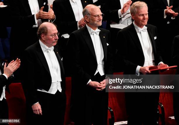 Nobel Prize in Physiology or Medicine 2017 laureates Jeffrey C Hall, Michael Rosbash and Michael W Young acknowledge applause during the Nobel award...