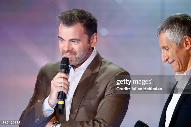 Clovis Cornillac and Nagui perform on stage during the 31st France Television Telethon at Pavillon Baltard on December 9, 2017 in Nogent-sur-Marne,...