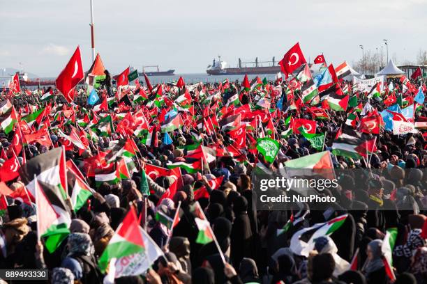 Protestors shouts slogans against US President Donald Trump as they hold Turkish and Palestine flag during a rally against Israel, in Istanbul,...