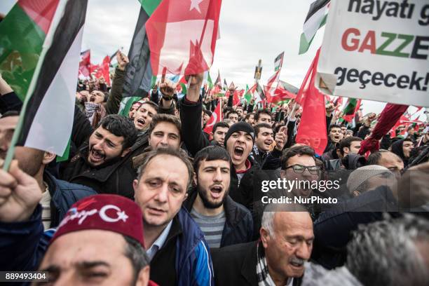Protestors shouts slogans against US President Donald Trump as they hold Turkish and Palestine flag during a rally against Israel, in Istanbul,...