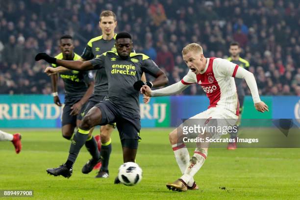 Donny van de Beek of Ajax scores the third goal to make it 3-0 during the Dutch Eredivisie match between Ajax v PSV at the Johan Cruijff Arena on...