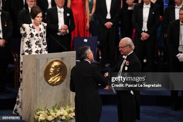 Kazuo Ishiguro, laureate of the Nobel Prize in Literature receives his Nobel Prize from King Carl XVI Gustaf of Sweden during the Nobel Prize Awards...