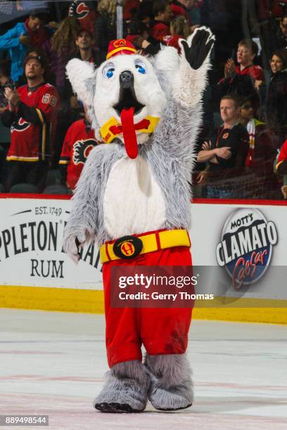 Harvey the Hound, the Calgary Flames mascot greets the fans in a NHL game against the Vancouver Canucks at the Scotiabank Saddledome on December 09,...